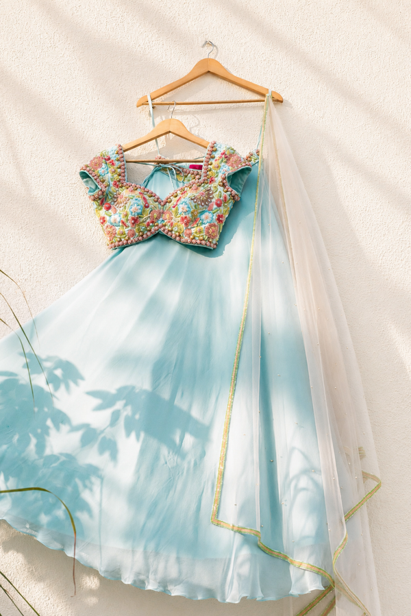 SKY BLUE GOERGETTE LEHENGA WITH COLORED EMB BLOUSE AND PINK DUPATTA